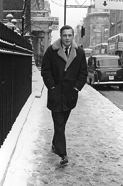 TV Presenter David Attenborough - March 1965 - walking to work on a snowy morning the day