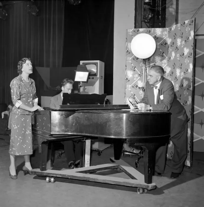 Framed Print : TV presenter Fred Wilby seen here beside the piano in the studios of Midland TV