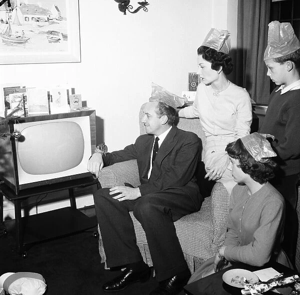Tv presenter Hughie Green seen here at home at Christmas time with his family