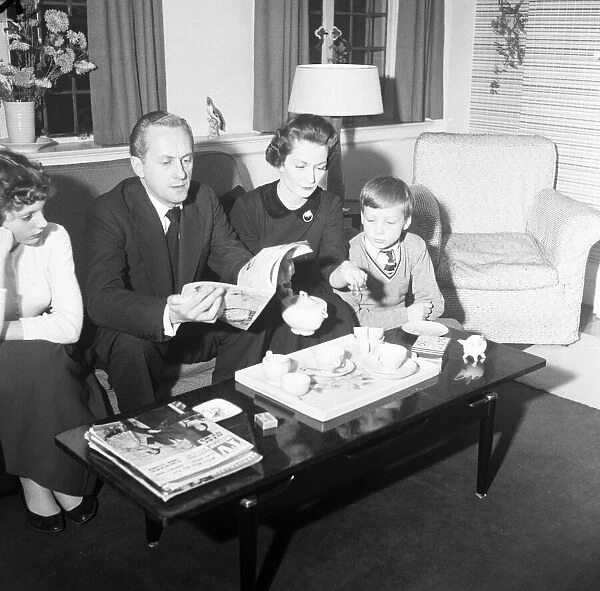 Tv presenter Hughie Green seen here at home with his family