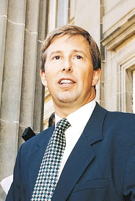 Framed Print : TV presenter Bill McFarlan wearing blue suit and green and blue spotted tie