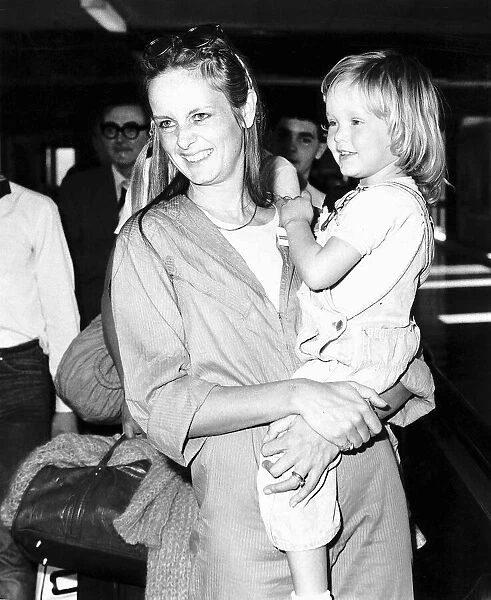 Twiggy model and actress leaving Heathrow airport for Los Angeles with daughter Carly who