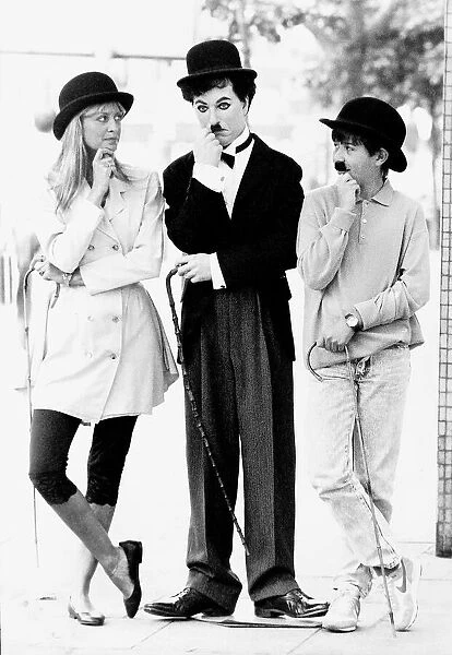 Twiggy model and actress with wax work of Charlie Chaplin