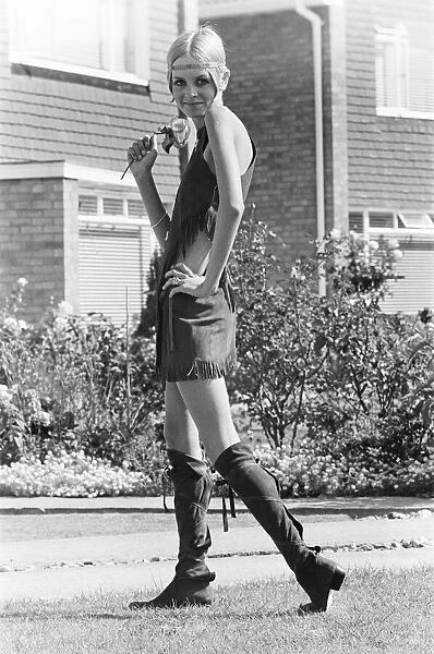 Twiggy, (real name Lesley Hornby) English model, seen in a Hippy gear outfit