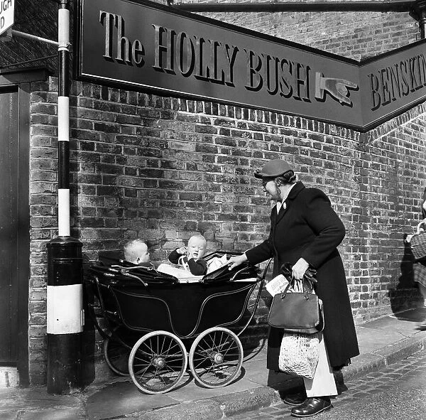 Twins in a pram on Holly Hill in Hampstead, North London. April 1954