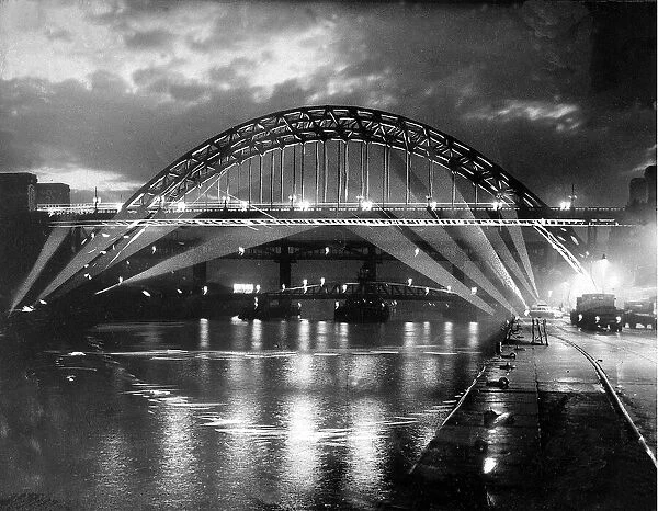 The Tyne Bridge iilluminated at night c. 1969