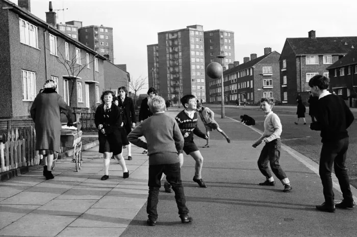 Framed Print : A typical street in Kirkby, Liverpool. Boys playing football in the street Framed Print : A typical street in Kirkby, Liverpool. Boys playing football in the street