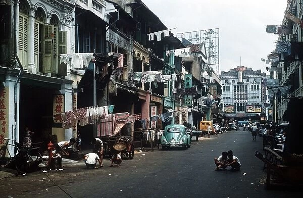 A typical street scene in Chinatown city in Singapore circa 1975