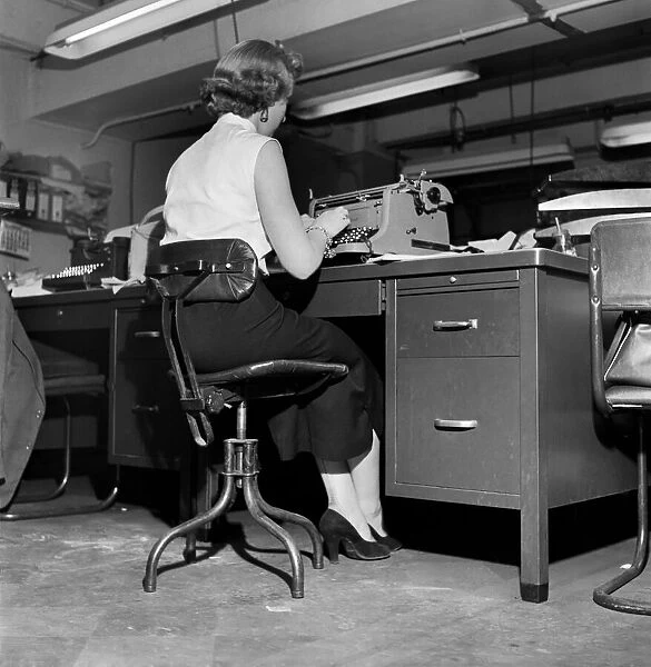 Typist seen here working in a typical 1953 office. September 1953 D5677