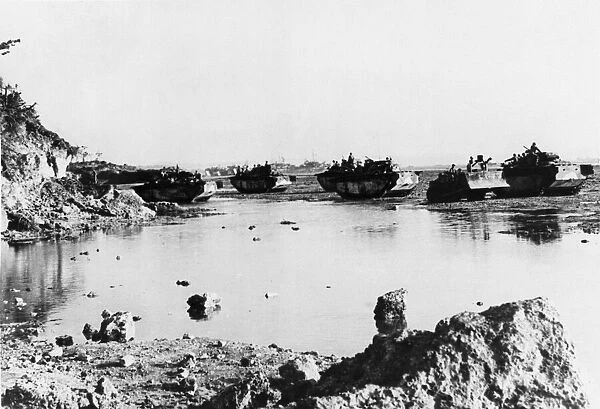 U. S. 10th Army rolls ashore Okinawa, a bulldozer and a group of amphibious tractors