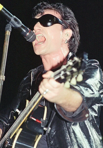U2 in concert on the Zoo TV Tour, Wembley Stadium. Bono performing on stage