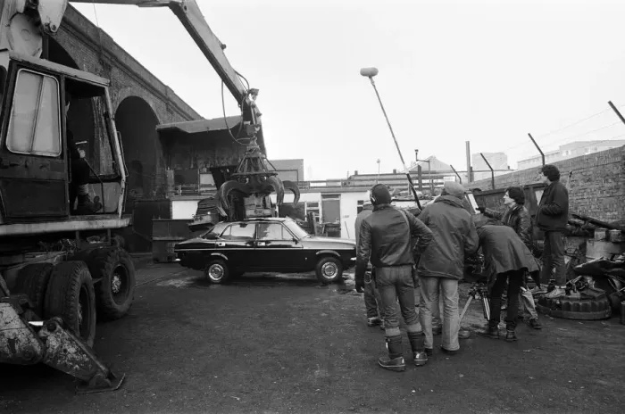 Framed Print : UB40 filming a video film in a scrapyard. The video film will feature songs from their Framed Print : UB40 filming a video film in a scrapyard. The video film will feature songs from their