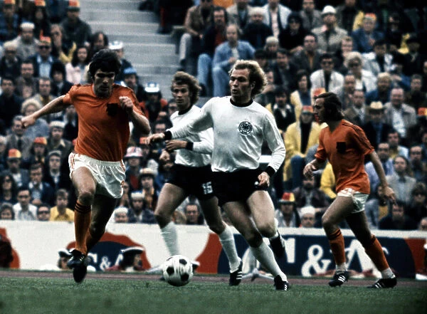 Uli Hoeness West Germany is tackled by Hollands Van Hanegem in the 1974 World Cup Final