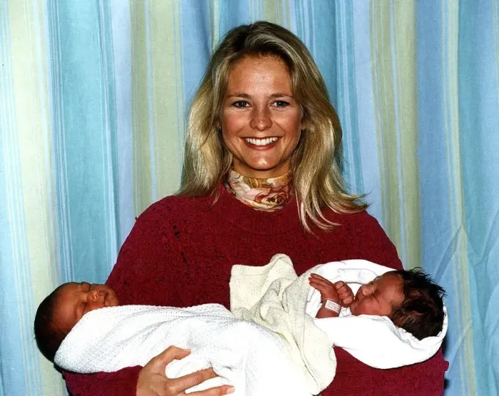 Framed Print : Ulrika Jonsson TV Presenter holding 2 babies Shaquelle Didson and Eleanor Louise Albury