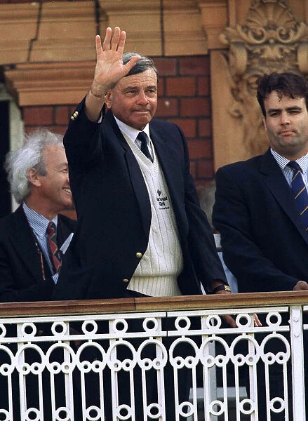 Umpire Dickie Bird wipes a tear from his eye as he stands on the balcony at the end of