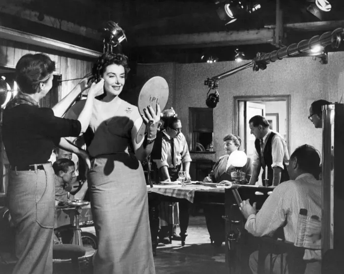 Framed Print : An un-named actress has her make-up touched up between filming at Ealing Studios Framed Print : An un-named actress has her make-up touched up between filming at Ealing Studios