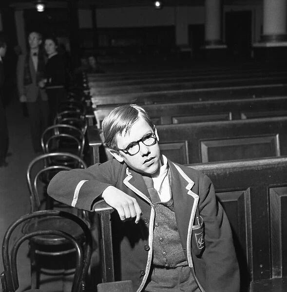 Un-named schoolboy sits through the rehearsals of the play