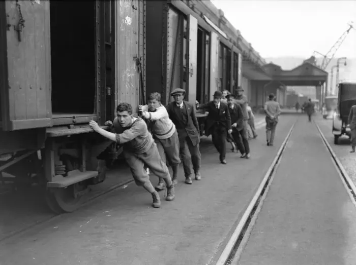 Framed Print : Undergraduates at Dover shunting luggage vans on to the boat train on the 8th day of