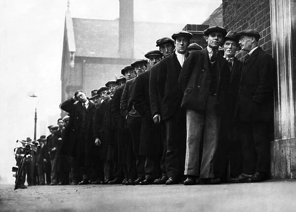 Unemployed men seen here queueing up at the Labour Exchange in the Midlands