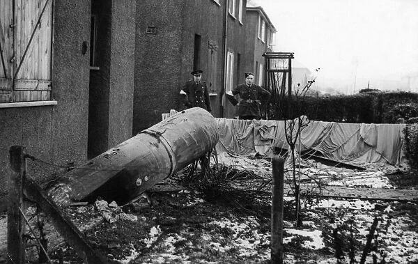 A unexploded parachute mine outside 10 Ellerby Grove, East Hull being visually inspected