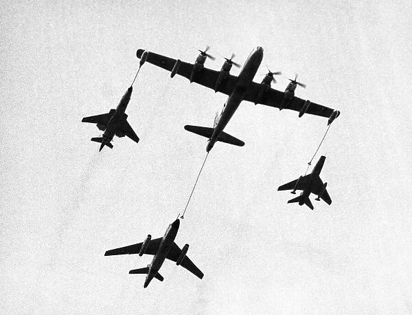 A United States Air Force tanker refuelling fighter planes during a demonstration at
