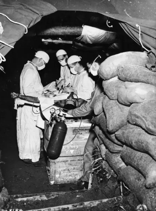 Framed Print : Units of the US Army Medical Corps in combat areas perform their duties under extreme