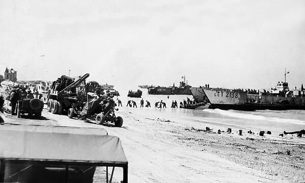 Unloading equipment on the beaches of Normandy on June 24th from various craft was in