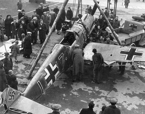 Unloading a German Messerschmitt plane shot down over England, at Blyth Market Place