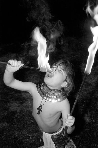 Unusual: Children. Fire Eater. 9 year old Tony Walls. Tony at his Fire Swallowing Act