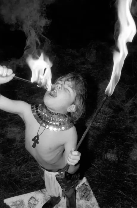 Framed Print : Unusual: Children. Fire Eater. 9 year old Tony Walls. Tony at his Fire Swallowing Act