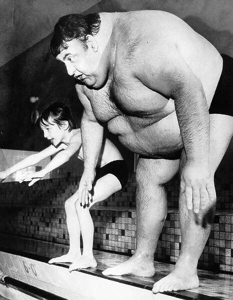 Unusual Pictures obese fat man tries to dive into swimming pool next to small boy