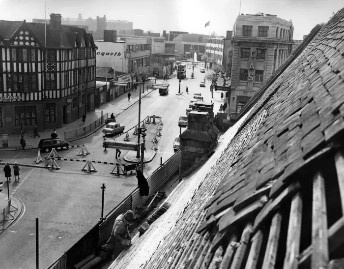 Framed Print : This unusual view of Corporation Street, Coventry, is taken as workmen repair the roof of Framed Print : This unusual view of Corporation Street, Coventry, is taken as workmen repair the roof of