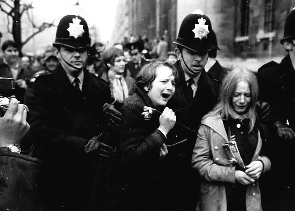Upset Beatles fans crying because Paul McCartney got married are led away by police March