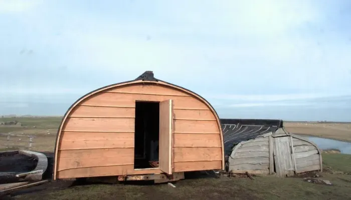 Framed Print : The upturned boats used as huts on Lindisfarne (Holy Island)