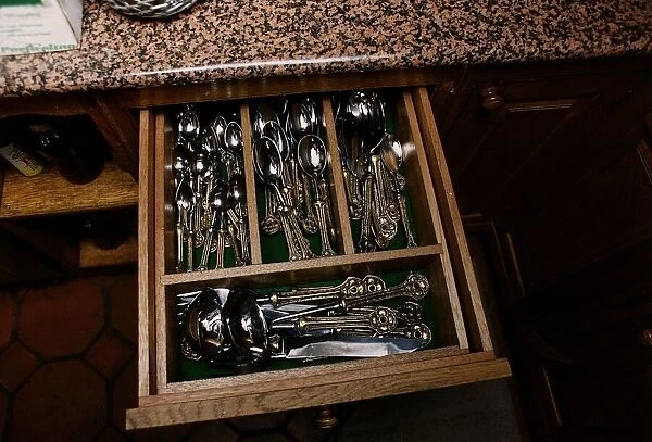 Uri Geller Drawer in his kitchen full of Gold and Silver Cutlery dbase A©Mirrorpix