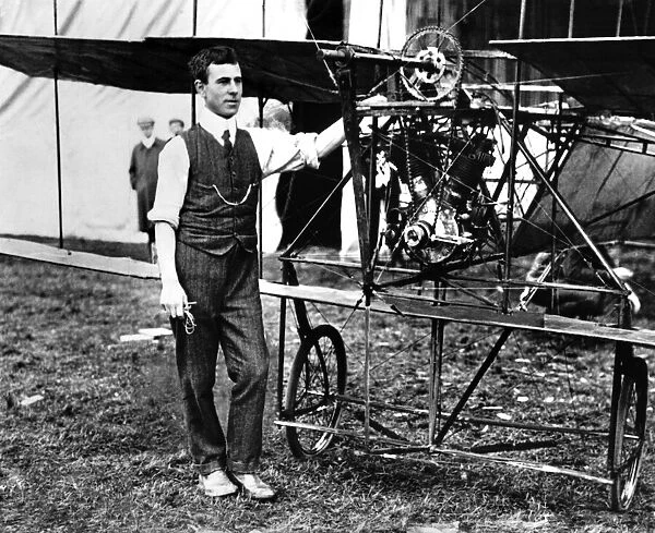 A V Roe, one of the early pioneers of British aviation, pictured standing next to his Roe