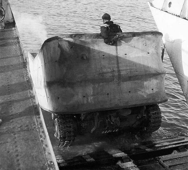 Valentine DD Swimming tanks leave the ramp of a landing craft