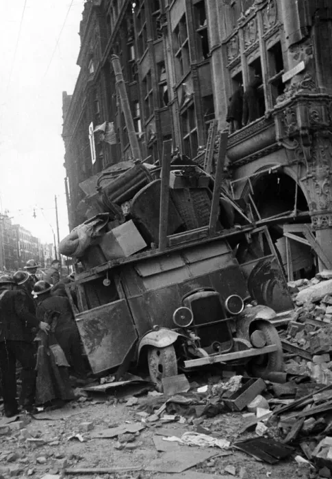 Framed Print : A van being loaded with furniture moving items from a bombed building is covered by Framed Print : A van being loaded with furniture moving items from a bombed building is covered by