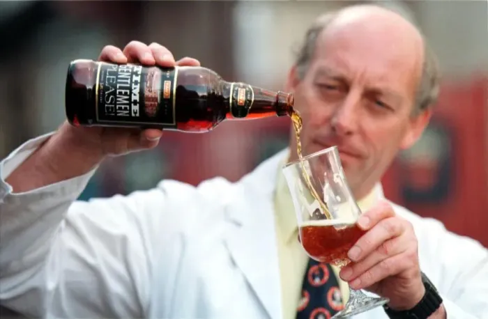 Framed Print : The Vaux Brewery in Sunderland - Vaux brewer Jim Murray pours a glass of Time Please ale