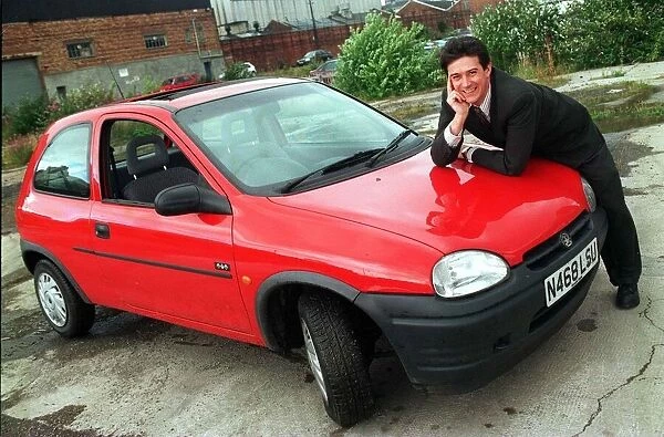 Vauxhall Corsa red August 1998 Man leaning on bonnet