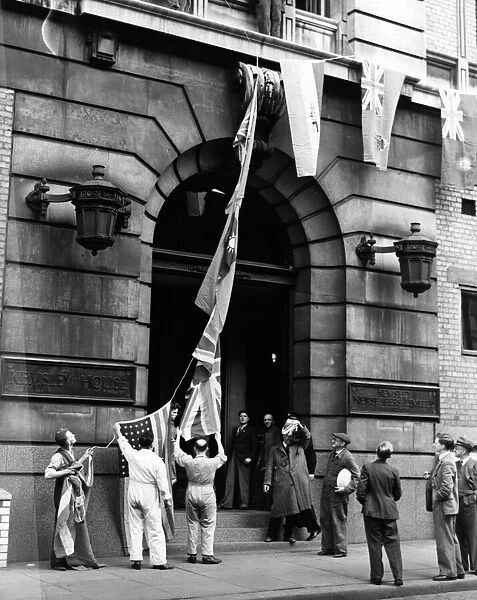 VE Day celebrations - hoisting the flag at Kemsley House, Manchester. 8th May 1945