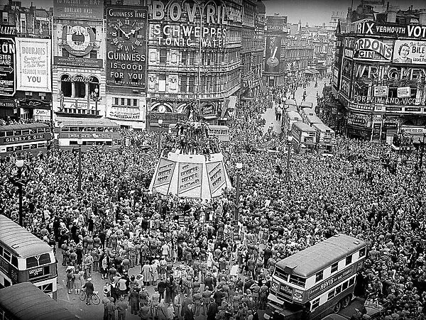 VE day celebrations at Piccadilly Circus at end of WW2 crowds fill the square on this
