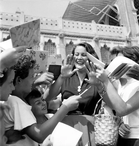 Venice Film Festival 1953. Italian film actress Jaqueline Collard being mobbed by