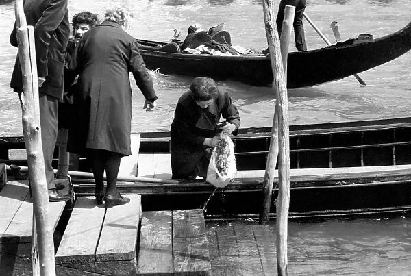 Venice, Italy Venetians seen here going shopping by gondilas. April 1975 75-2202-010