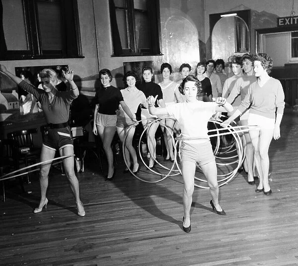 The Vernon Girls, singing and dance group, pictured trying out Hula hoops during