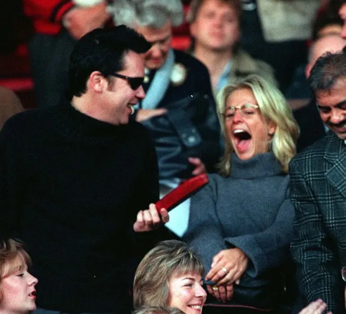 Framed Print : Vic Reeves and Ulrika Jonsson TV Presenter sitting in the stands at Old Trafford to watch