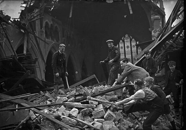 The vicar and parishioners search through the rubble and wreckage of St Clements