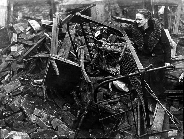 A victim of the blitz in Stafford Street, Bedminster, salvages some of the family