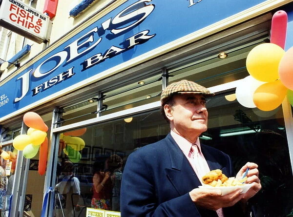 Victor Spinetti at the opening of his families chip shop at Marine Street, Cwm
