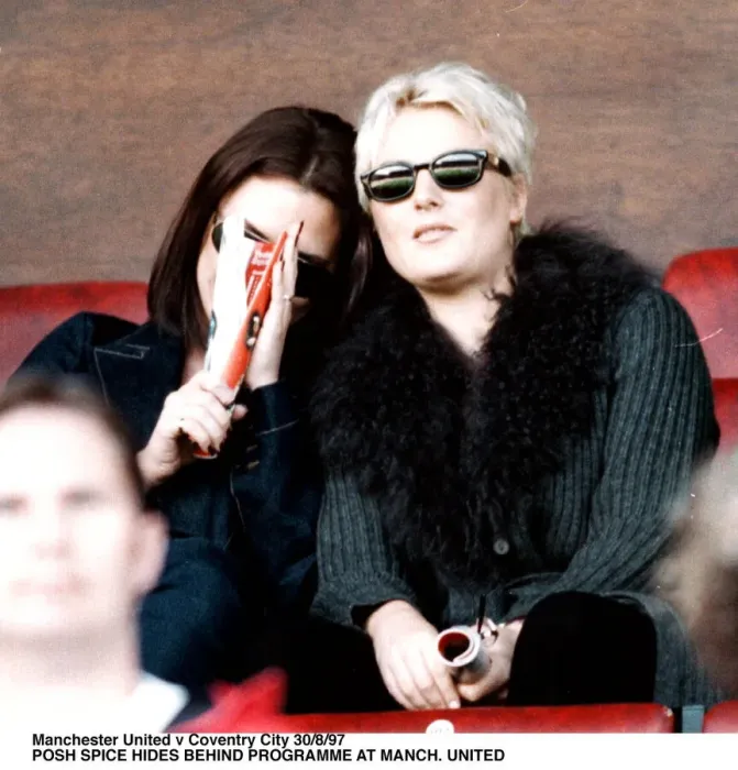 Framed Print : Victoria Adams posh spice of pop group the Spice Girls watching Manchester United v